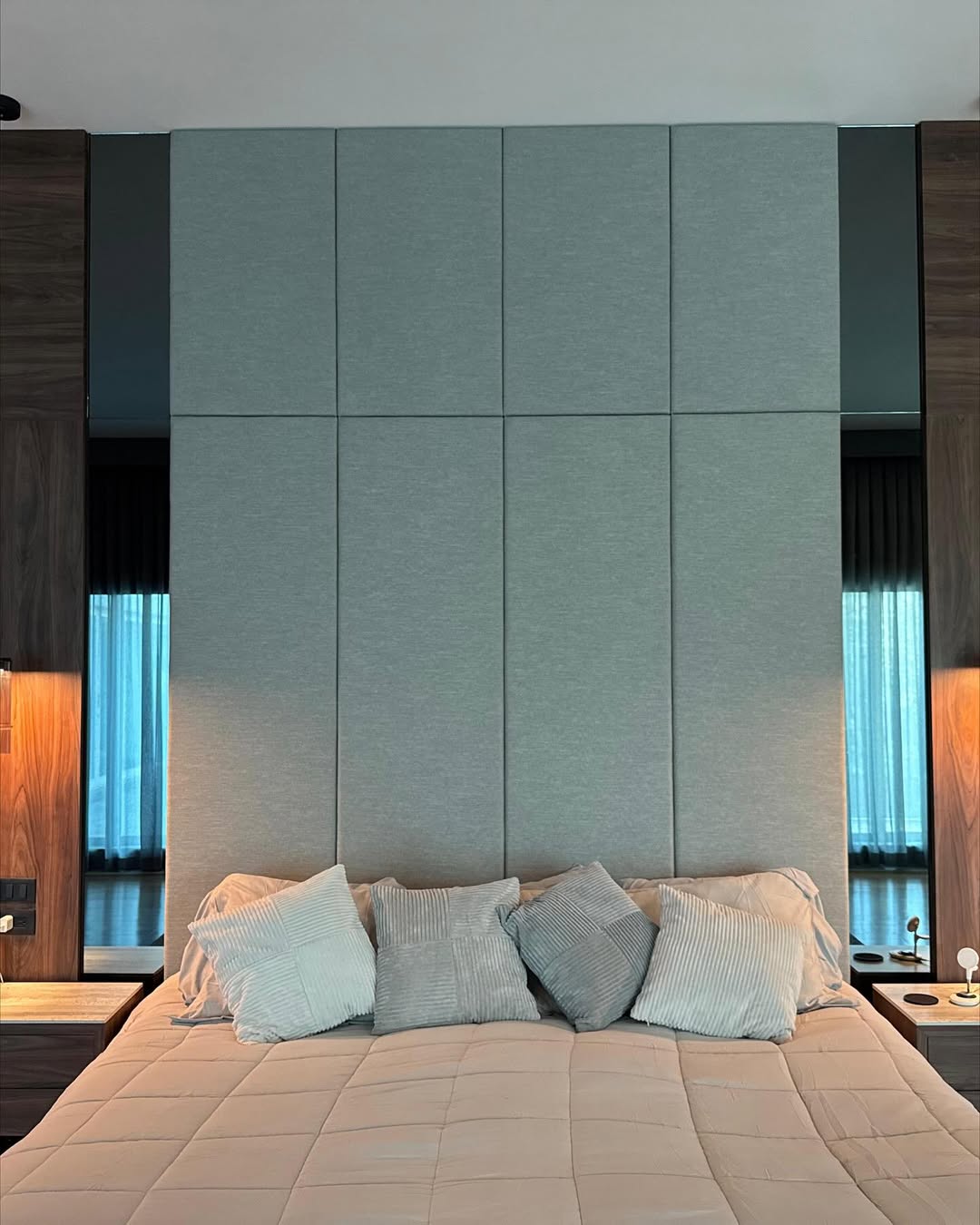 Walnut wood paneling and upholstered headboard detail
